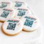 Custom branded sugar cookies printed with a business logo and a QR code to the company's website for promotional gifting. Custom branded sugar cookies printed with a business logo and a QR code to the company's website for promotional gifting.