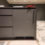 Bar fridge with a custom wood panel installation Bar fridge with a custom wood panel installation