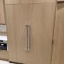 Built-in 60 inch fridge freezer with custom wood panel installation Built-in 60 inch fridge freezer with custom wood panel installation