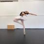 Sylvie Swanson, a 13-year-old student in NID's half-day program, working on her back flexibility during pointe class. Sylvie Swanson, a 13-year-old student in NID's half-day program, working on her back flexibility during pointe class.