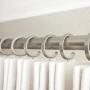 White drapery and nickel drapery hardware. White drapery and nickel drapery hardware.