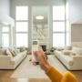 Motorized cellular shades in neutral living room. Motorized cellular shades in neutral living room.