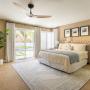 Drapery and shutters in a primary bedroom. Drapery and shutters in a primary bedroom.