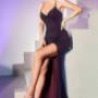 S-exy, flirty and fun, this fitted gown is cut from a soft stretch jersey flocked with glitter. A cowl neckline gathers into the waistline leading to a slinky leg slit. The ruched bottom shows off the open back with a lace up back detail. S-exy, flirty and fun, this fitted gown is cut from a soft stretch jersey flocked with glitter. A cowl neckline gathers into the waistline leading to a slinky leg slit. The ruched bottom shows off the open back with a lace up back detail.