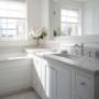 Bathroom with white kitchen cabinets with a granite top and a hole for a sink. Bathroom with white kitchen cabinets with a granite top and a hole for a sink.