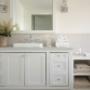 White bathroom vanity with sink. Vanity has 6 drawers and 2 doors. White bathroom vanity with sink. Vanity has 6 drawers and 2 doors.