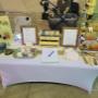 Our pop up display at in person markets. Featured are my husband and my children who support me in my work Our pop up display at in person markets. Featured are my husband and my children who support me in my work