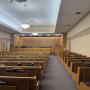 Inside of the chapel where large groups receive weekly religious instruction from various speakers Inside of the chapel where large groups receive weekly religious instruction from various speakers
