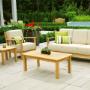 Salon extérieur accueillant avec mobilier en teck ARB, comprenant des sièges moelleux, des coussins vert vif et une table basse robuste, le tout sur fond de jardin luxuriant. Salon extérieur accueillant avec mobilier en teck ARB, comprenant des sièges moelleux, des coussins vert vif et une table basse robuste, le tout sur fond de jardin luxuriant.