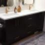 custom Tricorn Black vanity with golden handles matching the faucet. custom Tricorn Black vanity with golden handles matching the faucet.