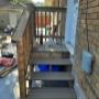 New deck to back door of upper unit. New deck to back door of upper unit.