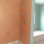 The owner is handicapped so they wanted a handicap access shower. There is a tub in the other corner. The owner is handicapped so they wanted a handicap access shower. There is a tub in the other corner.