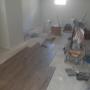 looking from kitchen into the main room of the unit. Laundry closet can be seen just to the left, coat closet is behind by the bench. Existing window has been replaced. looking from kitchen into the main room of the unit. Laundry closet can be seen just to the left, coat closet is behind by the bench. Existing window has been replaced.