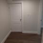 standing in hallway looking at den door. Bedroom 1 is to the right. standing in hallway looking at den door. Bedroom 1 is to the right.