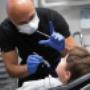 Dr. Walinder S. Dhol with a child Orthodontics patient in surrey Dr. Walinder S. Dhol with a child Orthodontics patient in surrey