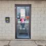 The front door of our business, with open and hour signs. The front door of our business, with open and hour signs.