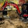 SPM Landscape & Excavation Operator using excavator to dig out a foundation for existing building addition SPM Landscape & Excavation Operator using excavator to dig out a foundation for existing building addition