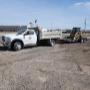SPM Landscape & Excavation truck hauling our skid steer SPM Landscape & Excavation truck hauling our skid steer