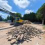 From structure to site — rubble removal underway with precision equipment. From structure to site — rubble removal underway with precision equipment.