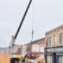 Precision at work — our crew carefully lowering the machine into place with the crane to complete the final stage of the project. Precision at work — our crew carefully lowering the machine into place with the crane to complete the final stage of the project.