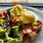 Bacon Eggs Benedict at Volta Victoria featuring crispy bacon, poached eggs, and golden hollandaise on toasted bread, paired with potato hash and greens — a popular brunch plate in Victoria, BC. Bacon Eggs Benedict at Volta Victoria featuring crispy bacon, poached eggs, and golden hollandaise on toasted bread, paired with potato hash and greens — a popular brunch plate in Victoria, BC.